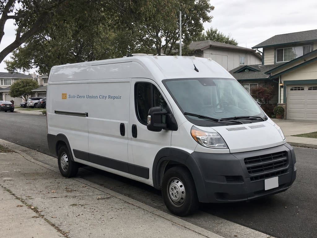 Sub-Zero Union City Repair van on a tree-lined Tri-City residential street near Union City